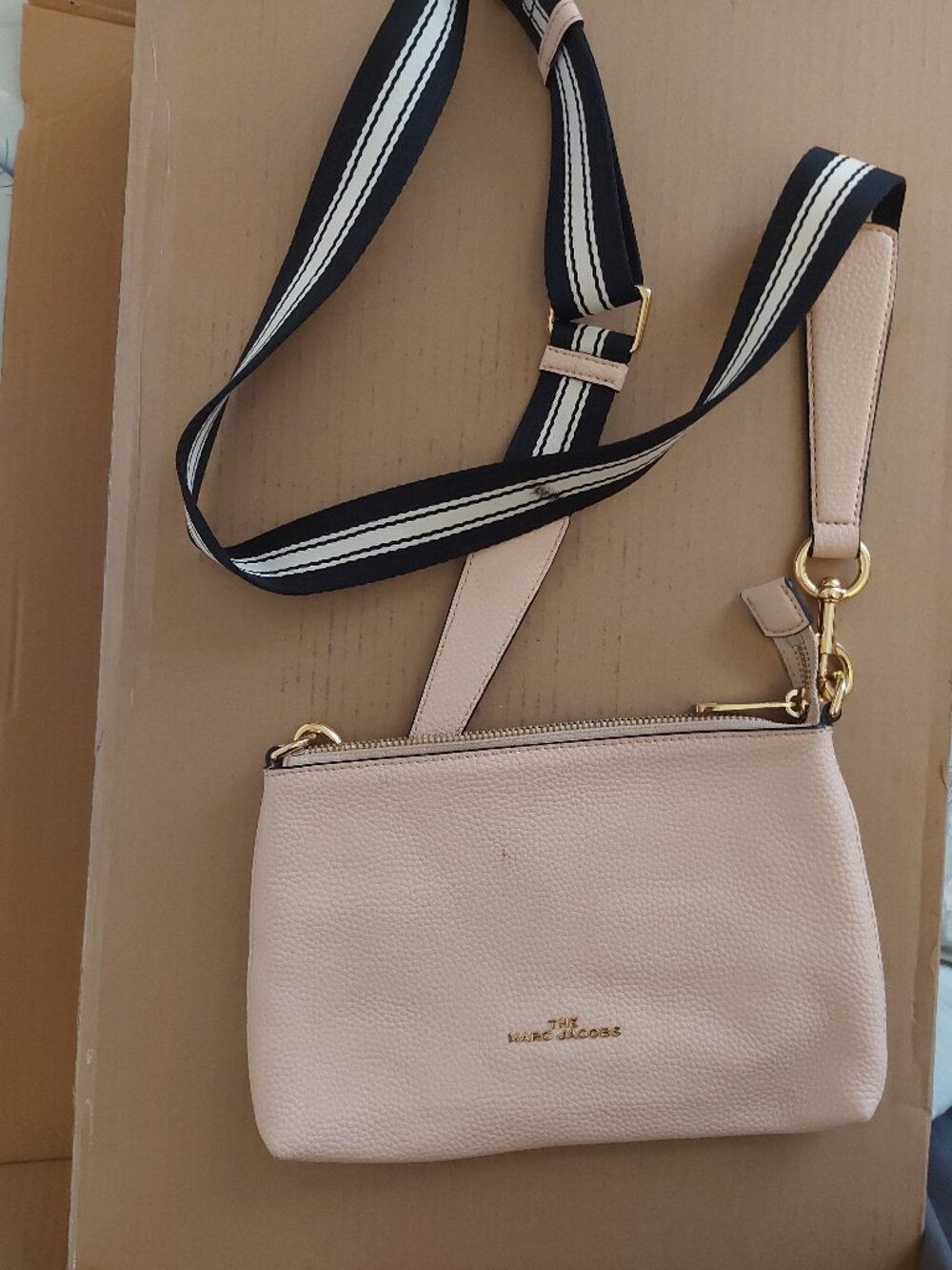Marc Jacobs pink crossbody bag with black and white strap